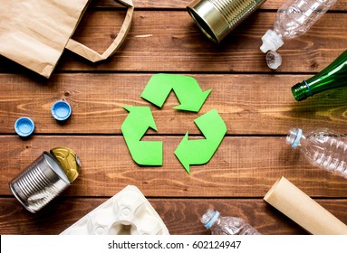 environment concept with recycling symbol on wooden background top view - Shutterstock ID 602124947