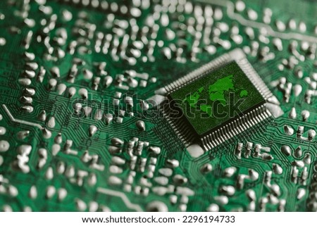 Environment  technology computer chip. Green world icon on circuit board technology innovations. Concept of  technology. Green Computing, Green Technology,  IT, CSR, and IT ethics.