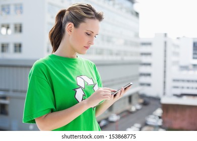 Environmental Activist Using Her Phone Outside On A Sunny Day