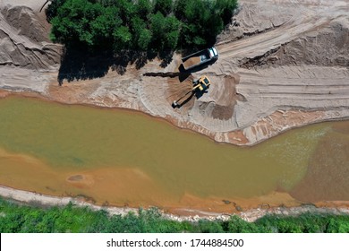 Environmental Conservation Issue. Machinery Mining River, Causing Siltation And Pollution 