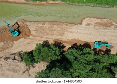 Environmental Conservation Issue. Machinery Mining River, Causing Siltation And Pollution 