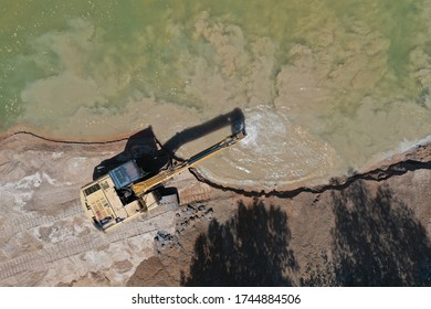 Environmental Conservation Issue. Machinery Mining River, Causing Siltation And Pollution 