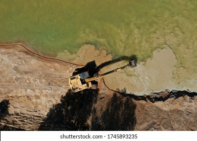 Environmental Conservation Issue. Machinery Mining River, Causing Siltation And Pollution