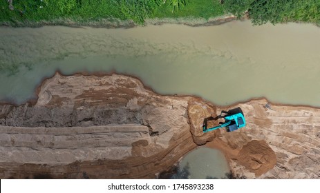 Environmental Conservation Issue. Machinery Mining River, Causing Siltation And Pollution