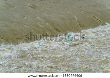 Environmental pollution - empty plastic bottles in Tiber river, Rome, Italy