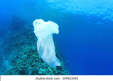 Environmental Pollution Problem - Plastic Bag On Ocean Coral Reef