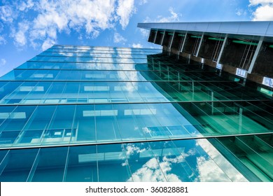 Environmental Sustainable Building With Glass Exterior, Couds Visible