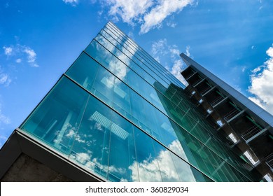 Environmental Sustainable Building With Glass Exterior, Couds Visible