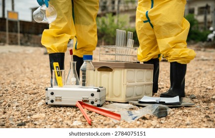 Environmental Worker preparing industrial sampling equipment during hazardous wastewater investigation and contamination monitoring activity.