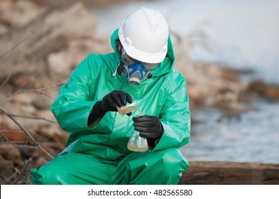 Environmentalist Collecting Water Sample For Analysis