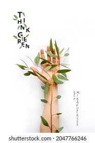 Environmentally friendly concept. Hand with green branch on it. The plant on the arm, symbolizing the unity of nature and man. Protecting and love nature. Think Green. Ecology Concept.  