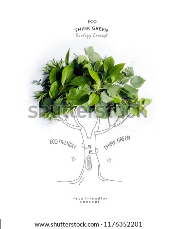 Environmentally friendly concept.Symbolic tree, made of green leaves and branches with hand drawn cartoon sketch a trunk with branches. Save environment rescue the forests. 
Ecology Concept.Flat lay.