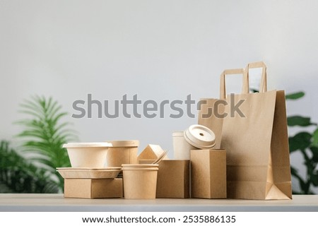 Environmentally friendly packaging, biodegradable materials, green packaging, recycling symbol, reuse, recycle concept.