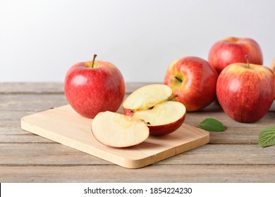 Envy Apples With Sliced On Wooden Table