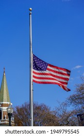 Ephrata, PA, USA - April 4, 2021: The USA American Flag Flies At Half-mast In Tribute To Mourn A Fallen Police Officer.