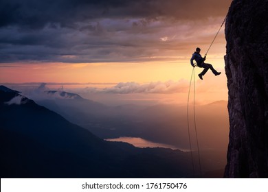 Epic Adventurous Extreme Sport Composite of Rock Climbing Man Rappelling from a Cliff. Mountain Landscape Background from British Columbia, Canada. Concept: Explore, Hike, Adventure, Lifestyle - Shutterstock ID 1761750476