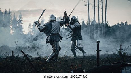 Epic Battlefield: Two Armored Medieval Knights Fighting With Swords. Dark Ages Army Warfare. Action Battle Of Armored Warrior Soldiers, Killing Enemy. Cinematic Historical Reenactment.