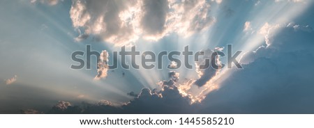 Epic cloudy sky holy sun light beams