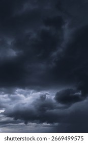 Epic Dramatic Storm sky with dark blue gray black cumulus rainy clouds abstract background texture, thunderstorm