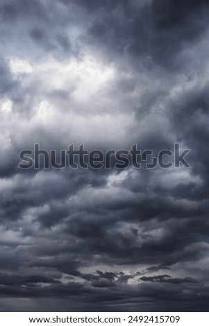 Epic Dramatic Storm sky with dark cumulus rainy clouds abstract background texture, thunderstorm