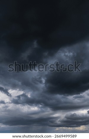 Epic Dramatic Storm sky with dark grey black cumulus rainy clouds abstract background texture, thunderstorm