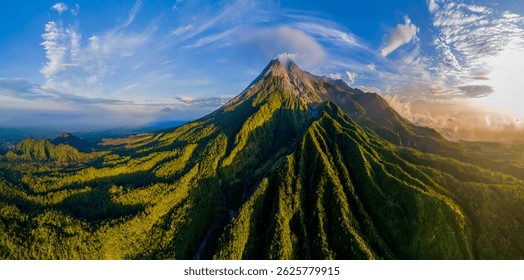 Epic drone shot mount Merapi volcano at sunrise from Klangon hill