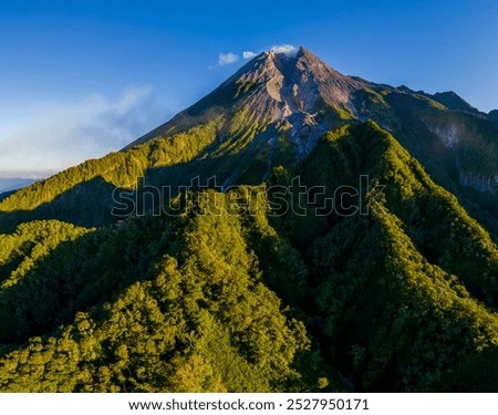 Epic drone shot of Mount Merapi at sunrise from Klangon hill