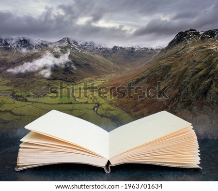 Epic flying drone landscape image of Langdale pikes and valley in Winter in pages of imaginary reading book