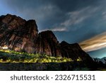 Epic Journey: Evening Traffic Through Zion National Park, Utah, with Majestic Red Rocks as the Breathtaking Backdrop, Immortalized in Stunning 4K