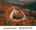 Epic New England Autumn Curved Road Bend Aerial View White Mountains New Hampshire. Fall Foliage Vibes Scenic Byway Mountain Pass Adventure