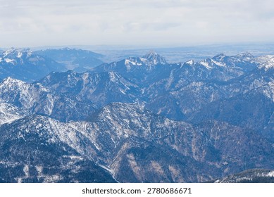 Epic panoramic view of endless Alpine mountain ranges covered with snow