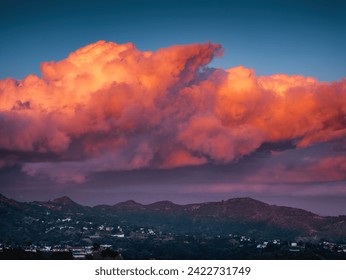 Epic red sunset clouds over Hollywood Hills mountains background. - Powered by Shutterstock