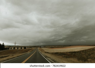 Epic road trip journey destination adventure winding wide open road along highway into stormy skies. - Shutterstock ID 782419822