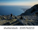 Epic scenery with hiker on top of Mount Ainos, the tallest mountain on the Ionian island of Cephalonia