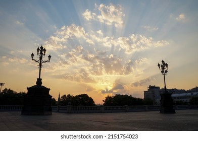 Epic Sunrise Sky With Sun Rays And Clouds Above The City