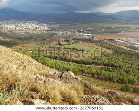 Epic view from mount precipice - believed to be the site of the rejection of jesus, outside the southern edge of Nazareth, north of Israel - on a dramatic winter day with cloudy gray sky 
