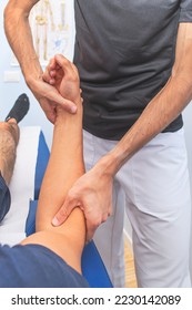 Epicondylitis treatment or forearm elbow treatment by a physical therapist - Shutterstock ID 2230142089