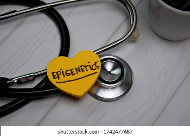Epigenetics write on sticky note isolated on wooden table. Medical concept