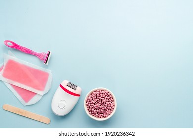 Epilation Concept. Set Of Epilator With Wax Strips And Razor, Flat Lay