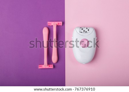 Epilator, disposable razor, on a pink background, space for text.