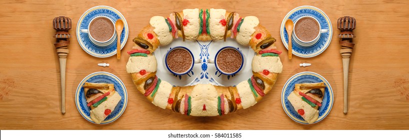 Epiphany cake, Kings cake, Roscon de reyes or Rosca de reyes with traditional mexican chocolate cup made with cinnamon