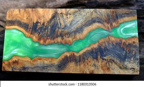 epoxy resin Stabilizing Afzelia burl exotic wood green background, Abstract art picture photo, print design and your advertisement