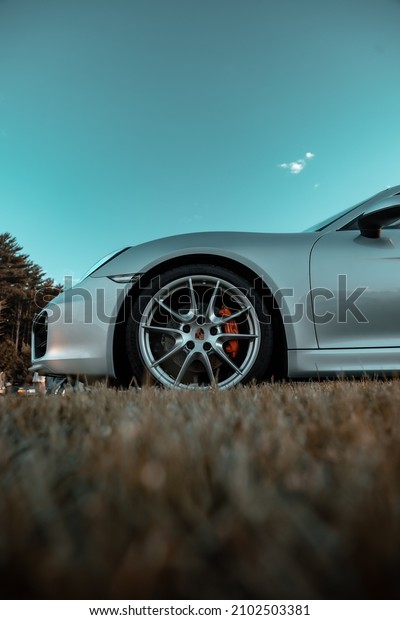 EPPING NH, UNITED STATES - Jul 18, 2020: A closeup\
shot of the tire of a fancy car in a car show in Epping NH, United\
States