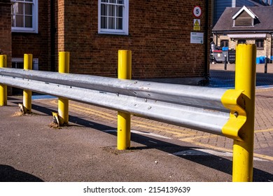 Epsom Surrey, London, May 08 2022, Car Safety Crash Barrier With Yellow Post In A Public Car Park With No People