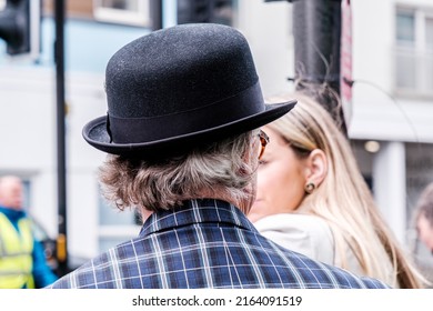 Epsom Surrey, London UK, June 04 2022, Man Wearing Traditional Black Bowler Hat And Funky Bright Jacket