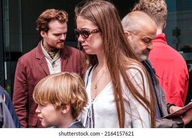 Epsom Surrey, London UK, June 04 2022, Brother And Sister Walking In A Crowd Close Up