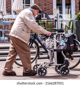 Epsom Surrey, London UK, June 10 2022, Elderly Older Man Using A Walking Frame To Assist Walking