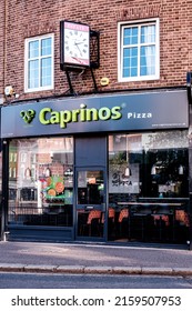 Epsom Surrey, London UK, May 22 2022,  Caprinos High Street Takeaway Fast Food Pizza Shop Or Store With No People