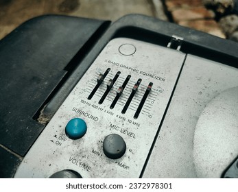 Equalizer control button on the music player device, sound tone control on the device