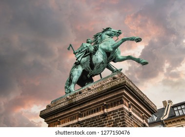 The Equestrian Statue Of Absalon On Højbro Plads In Copenhagen, Denmark, Near Christiansborg Palace, Under A Colorful, Cloudy Sky